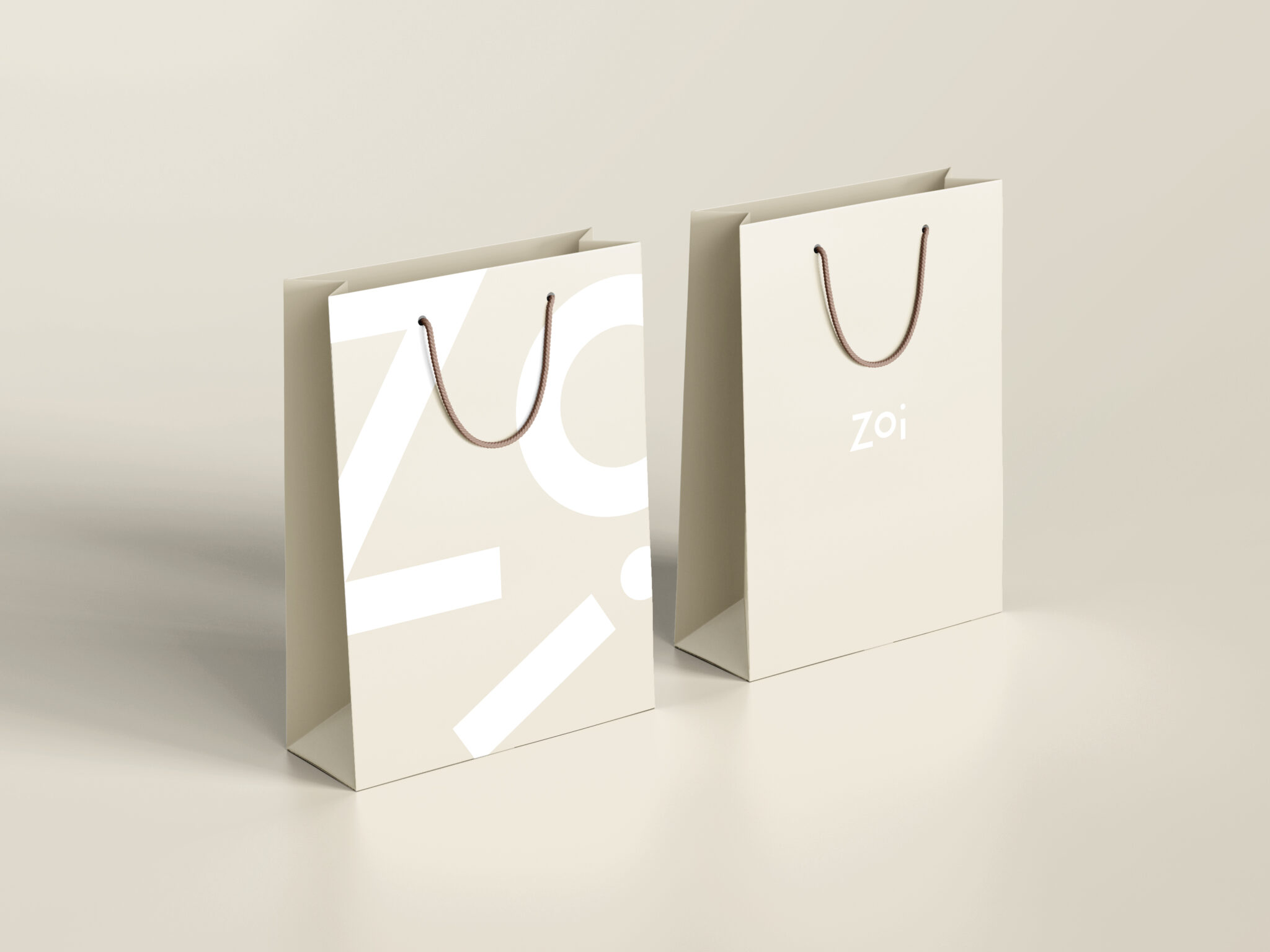 Mockup af poser med Zois nye logo